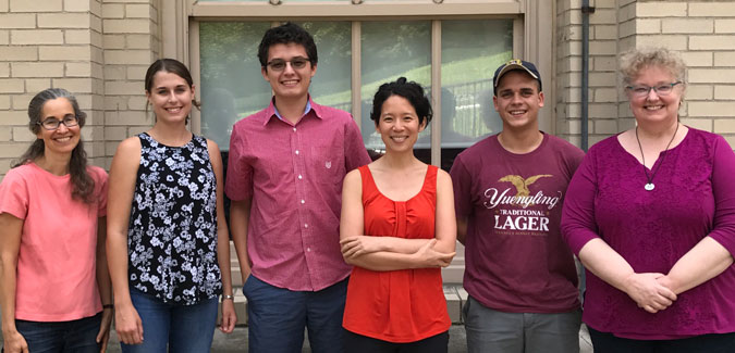 Lillian Chong poses next to five people