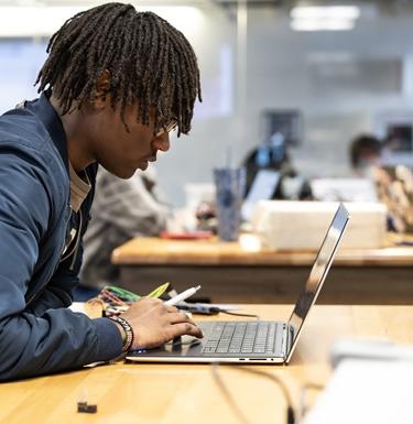Student working on a laptop